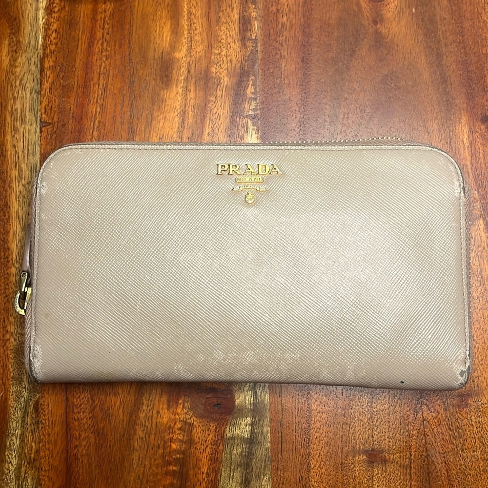 Project/rehab/fixer Prada beige Saffiano leather wallet with zipper.